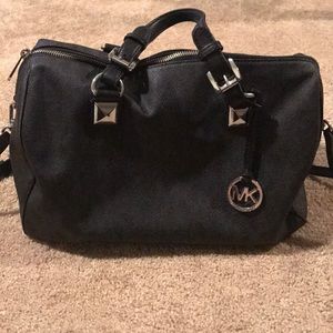 Black Michael Kors bag uses